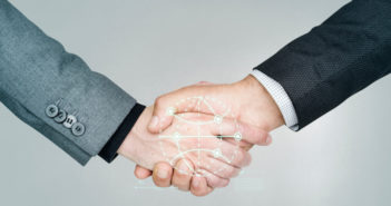 Business people shaking hands for a deal