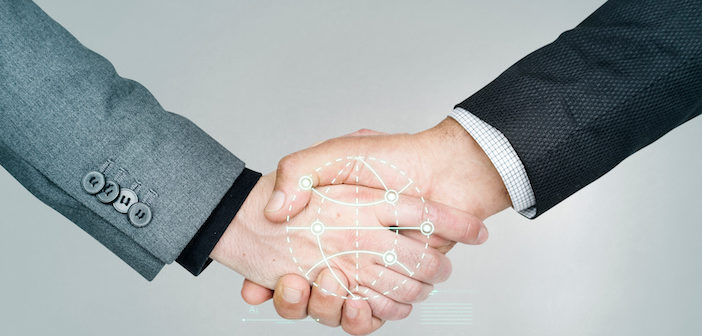 Business people shaking hands for a deal