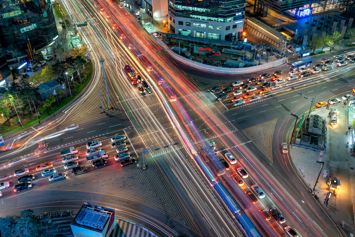 Night scene of light trails traffic speeds through an intersection in Gangnam center business district of Seoul at Seoul city, South Korea.