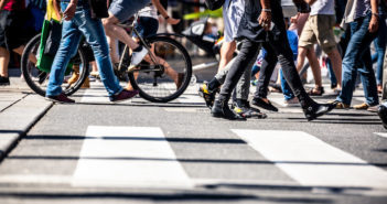 People on pedestrian crossings, on foot and by bicycle