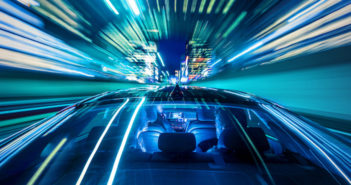 Moving forward, heading for the citylife, sitting in the backseat of a car while the cabdriver drives through a tunnel