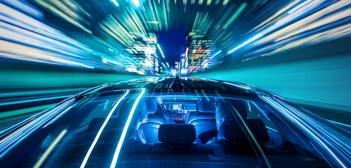 Moving forward, heading for the citylife, sitting in the backseat of a car while the cabdriver drives through a tunnel