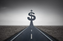 Road heading toward a dollar sign