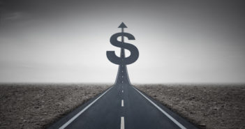 Road heading toward a dollar sign